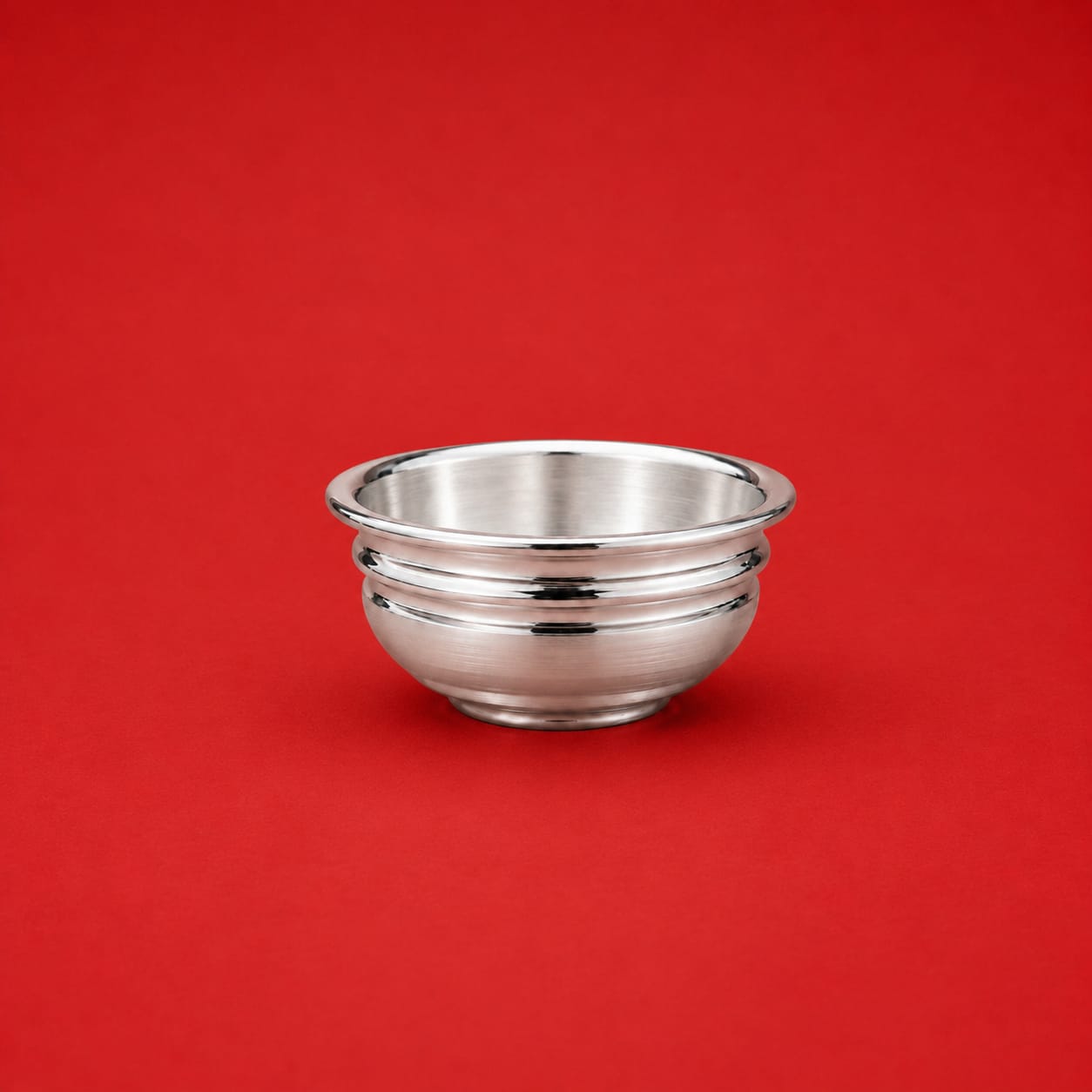 Silver Bowl Vati for Divine Pooja on red background