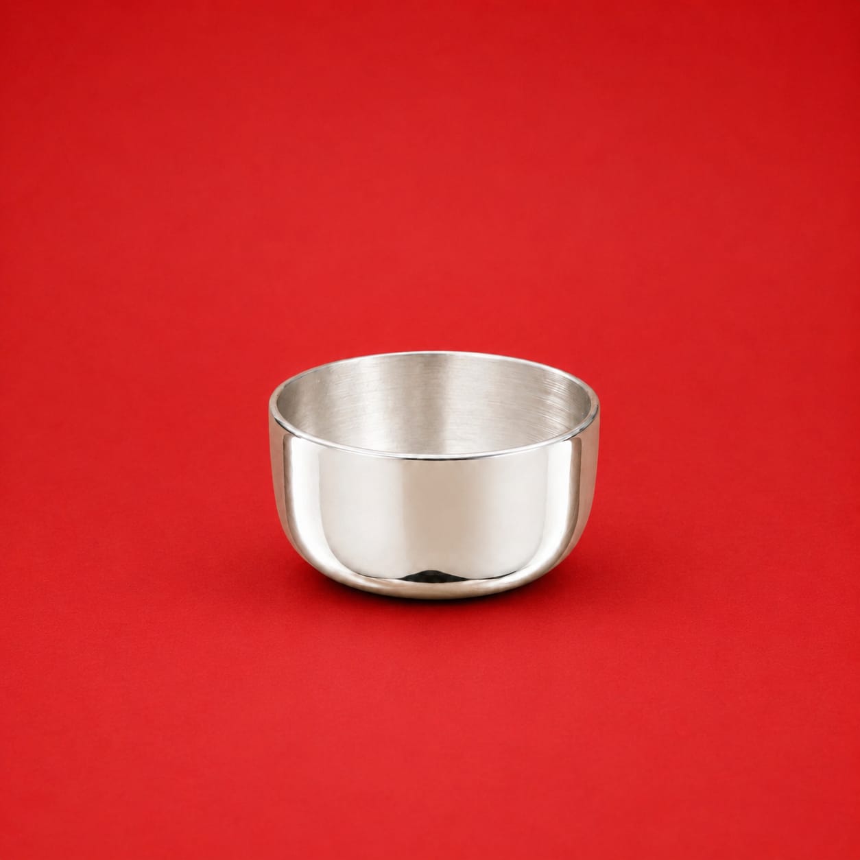 Silver Bowl Vati for Pooja on red background