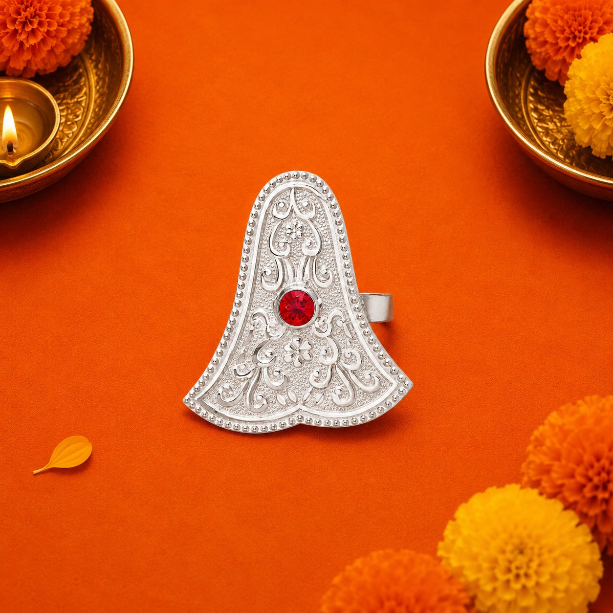 Silver Ganpati Sond Traditional Abhushan on orange background