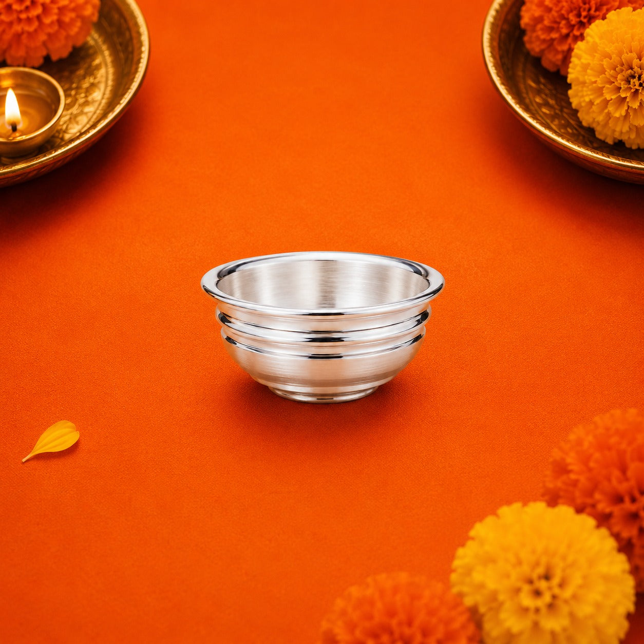 Silver Bowl Vati for Divine Pooja on orange background