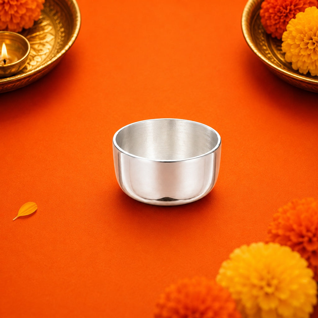 Silver Bowl Vati for Pooja on orange background